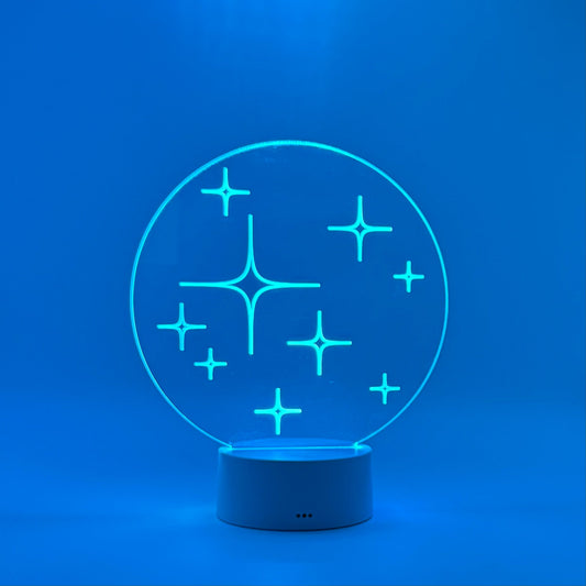 Blue LED night light with star design on a blue background