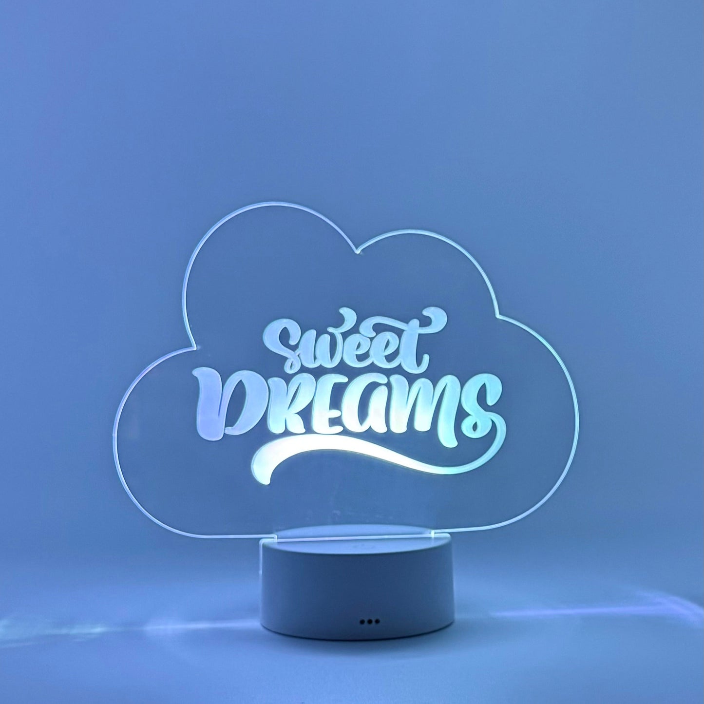 Cloud-shaped night light with 'sweet dreams' text on a blue background