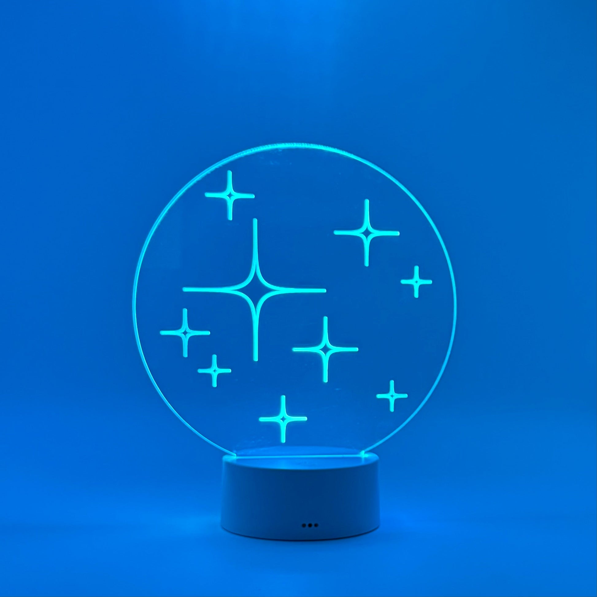 Blue LED night light with star design on a blue background
